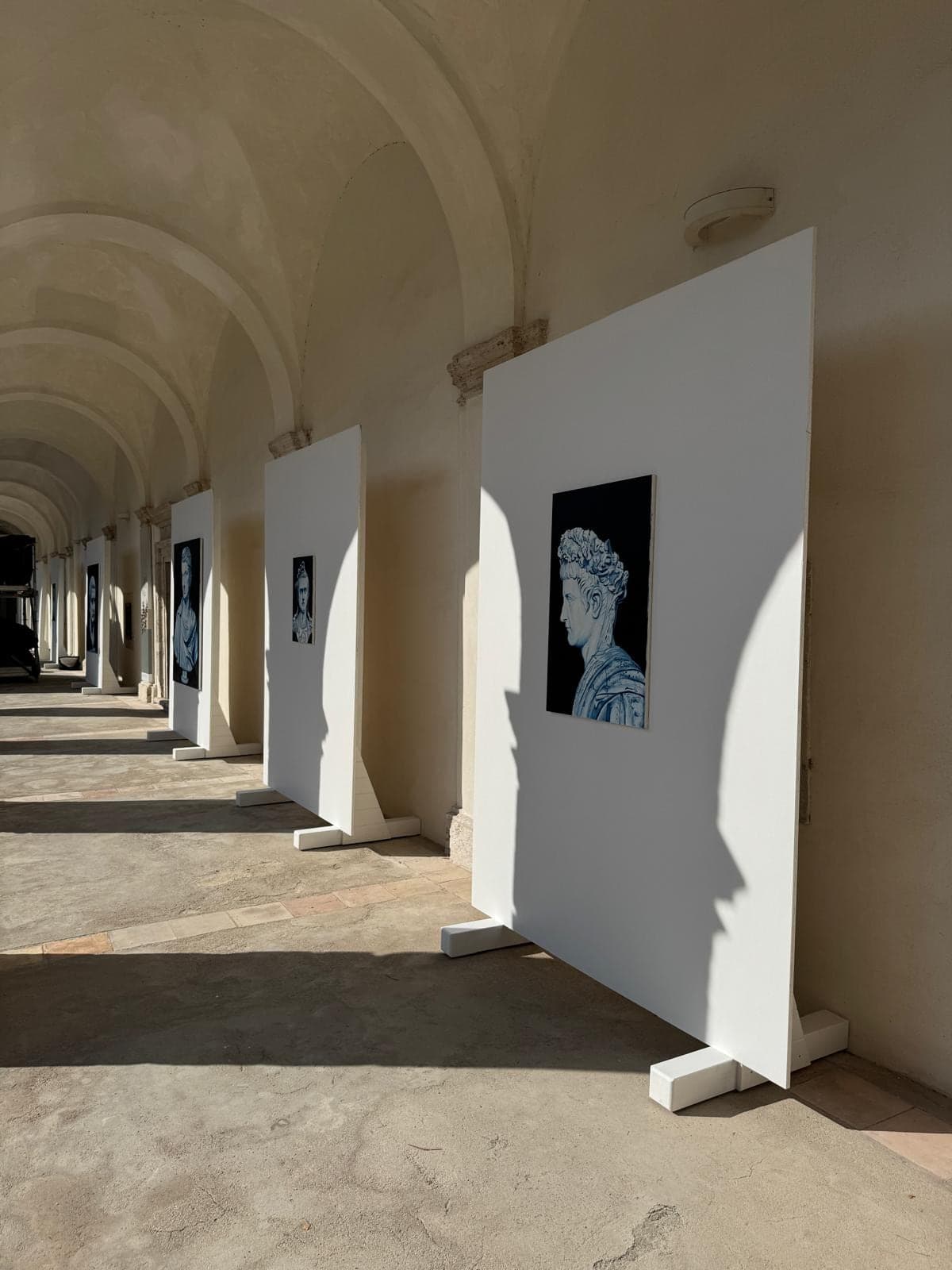 Portraits along the cloister