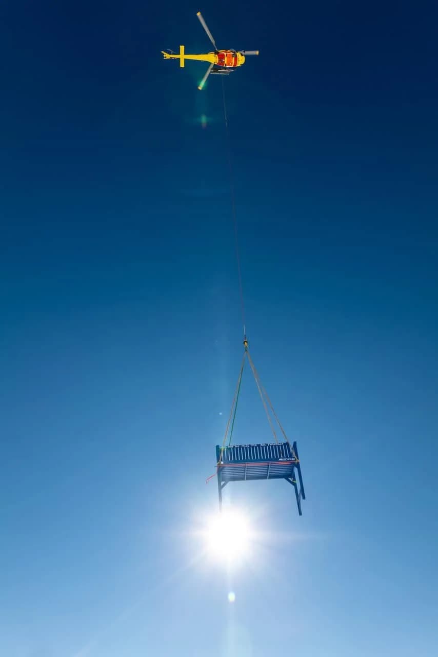 A 700kg blue bench appears out of the sky in St. Moritz — image 1